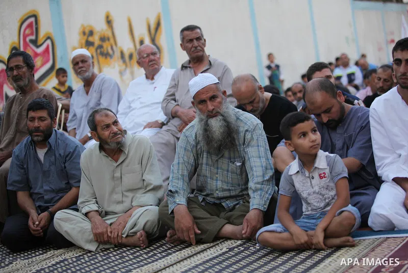 Palestinians attend the Eid al-Fitr prayer in Gaza City on July 28, 2014.The U.N. Security Council agreed on a statement on Sunday urging Israel, Palestinians and Islamist Hamas militants to implement a humanitarian truc...