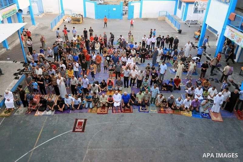 Displaced Palestinians attend the Eid al-Fitr prayer at a United Nations school, in Gaza City on July 28, 2014. The U.N. Security Council agreed on a statement on Sunday urging Israel, Palestinians and Islamist Hamas mil...