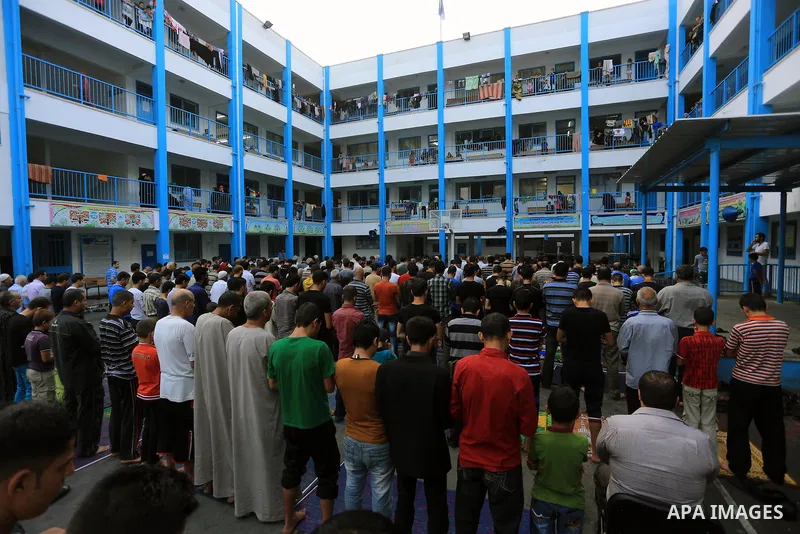 Displaced Palestinians attend the Eid al-Fitr prayer at a United Nations school, in Gaza City on July 28, 2014. The U.N. Security Council agreed on a statement on Sunday urging Israel, Palestinians and Islamist Hamas mil...