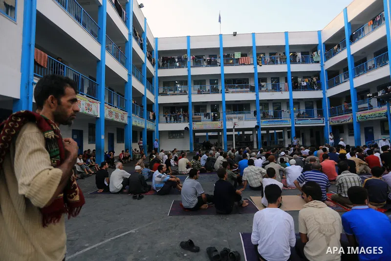Displaced Palestinians attend the Eid al-Fitr prayer at a United Nations school, in Gaza City on July 28, 2014. The U.N. Security Council agreed on a statement on Sunday urging Israel, Palestinians and Islamist Hamas mil...