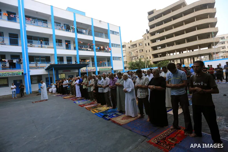 Displaced Palestinians attend the Eid al-Fitr prayer at a United Nations school, in Gaza City on July 28, 2014. The U.N. Security Council agreed on a statement on Sunday urging Israel, Palestinians and Islamist Hamas mil...