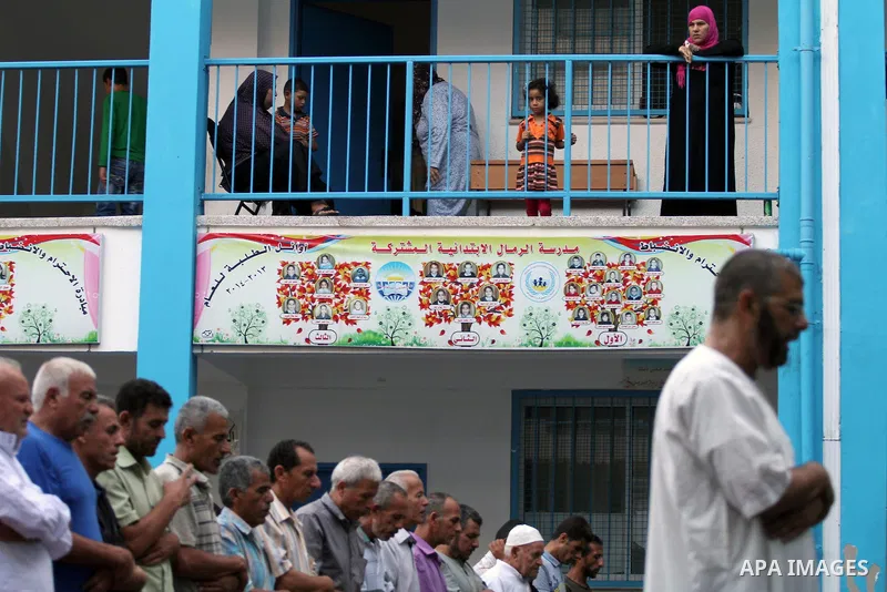 Displaced Palestinians attend the Eid al-Fitr prayer at a United Nations school, in Gaza City on July 28, 2014. The U.N. Security Council agreed on a statement on Sunday urging Israel, Palestinians and Islamist Hamas mil...