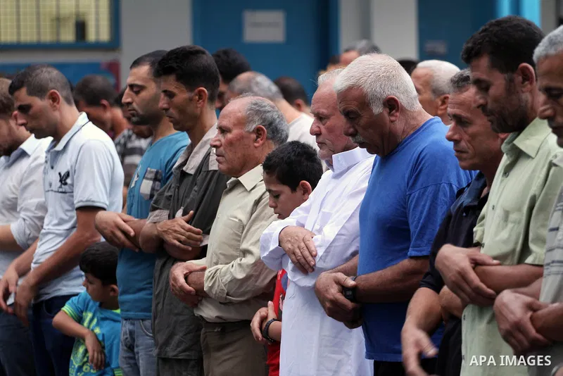Displaced Palestinians attend the Eid al-Fitr prayer at a United Nations school, in Gaza City on July 28, 2014. The U.N. Security Council agreed on a statement on Sunday urging Israel, Palestinians and Islamist Hamas mil...