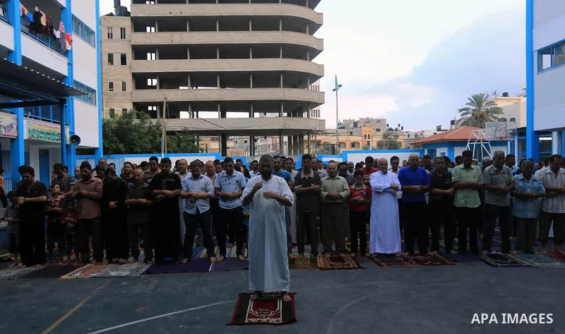 Displaced Palestinians attend the Eid al-Fitr prayer at a United Nations school, in Gaza City on July 28, 2014. The U.N. Security Council agreed on a statement on Sunday urging Israel, Palestinians and Islamist Hamas mil...