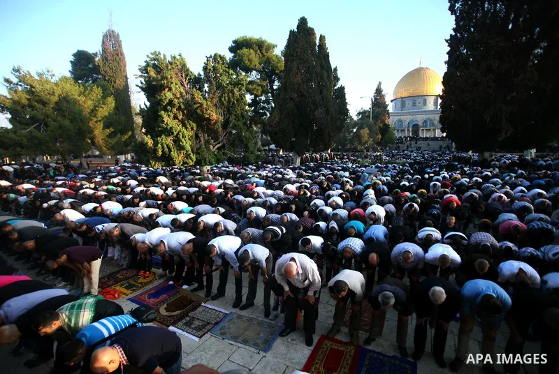 Palestinian Muslims attend the Eid al-Fitr prayer at al-Aqsa mosque in Jerusalem's Old City on July 28, 2014. Muslims around the world are celebrating Eid al-Fitr which marks the end of the month of Ramadan, after the si...