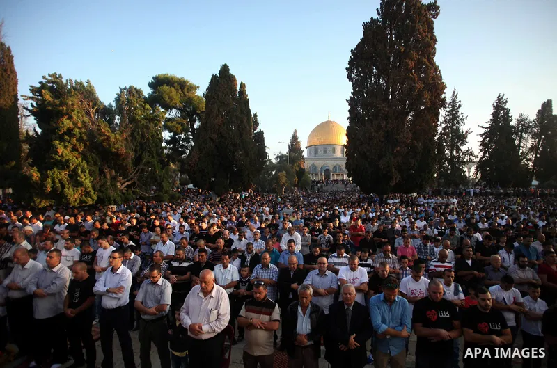 Palestinian Muslims attend the Eid al-Fitr prayer at al-Aqsa mosque in Jerusalem's Old City on July 28, 2014. Muslims around the world are celebrating Eid al-Fitr which marks the end of the month of Ramadan, after the si...