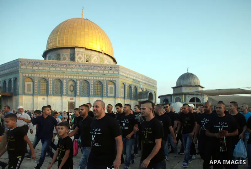 Palestinian protesters take part in a protest against the Israeli military operation on Gaza Strip following the Eid al-Fitr prayer at al-Aqsa mosque in Jerusalem's Old City on July 28, 2014. Muslims around the world are...