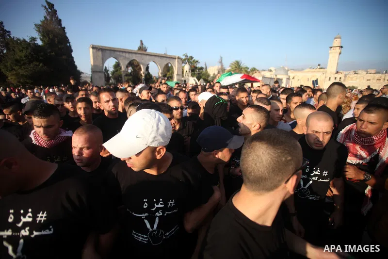 Palestinian protesters take part in a protest against the Israeli military operation on Gaza Strip following the Eid al-Fitr prayer at al-Aqsa mosque in Jerusalem's Old City on July 28, 2014. Muslims around the world are...