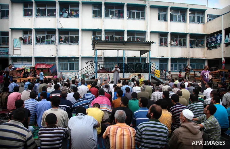 Displaced Palestinians attend the Eid al-Fitr prayer at a United Nations school, in Gaza City on July 28, 2014. The U.N. Security Council agreed on a statement on Sunday urging Israel, Palestinians and Islamist Hamas mil...