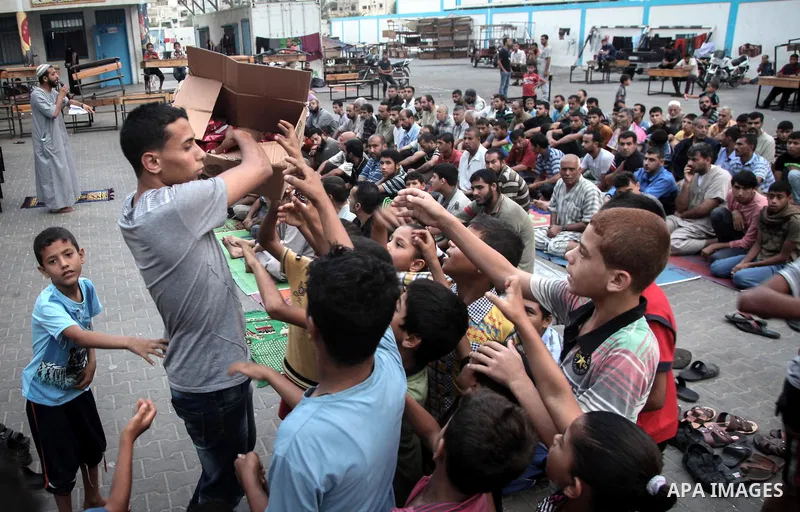 Displaced Palestinians attend the Eid al-Fitr prayer at a United Nations school, in Gaza City on July 28, 2014. The U.N. Security Council agreed on a statement on Sunday urging Israel, Palestinians and Islamist Hamas mil...