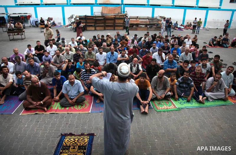 Displaced Palestinians attend the Eid al-Fitr prayer at a United Nations school, in Gaza City on July 28, 2014. The U.N. Security Council agreed on a statement on Sunday urging Israel, Palestinians and Islamist Hamas mil...