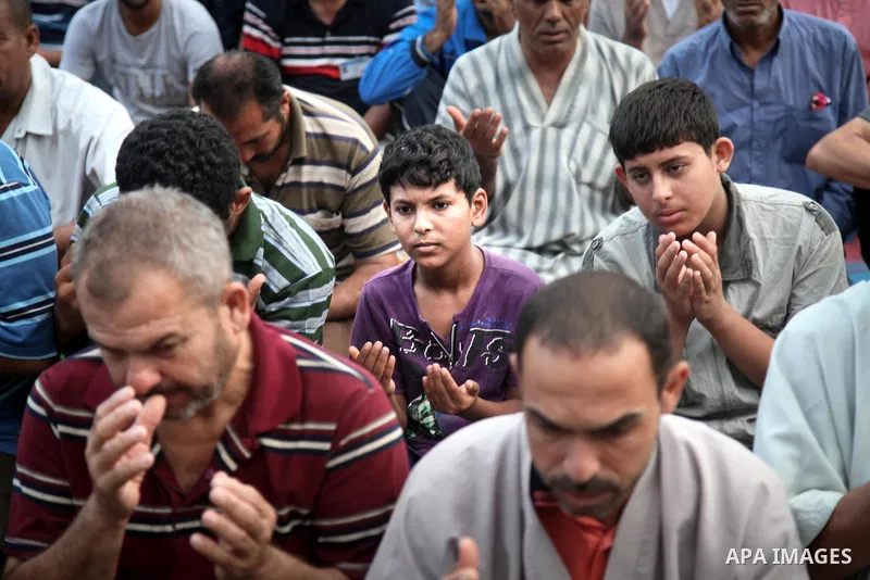 Displaced Palestinians attend the Eid al-Fitr prayer at a United Nations school, in Gaza City on July 28, 2014. The U.N. Security Council agreed on a statement on Sunday urging Israel, Palestinians and Islamist Hamas mil...