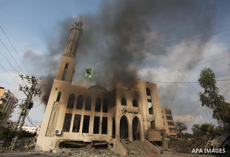 Palestinians react in front of a destroyed mosque after it was hit by an Israeli air strike, on July 29, 2014, in Gaza City. Bloodshed in and around Gaza surged with strikes killing at least 13 Palestinians, a day after...