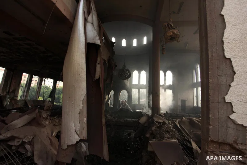 Palestinian firefighters extinguish fire at a mosque after it was hit by an Israeli air strike, on July 29, 2014, in Gaza City. Bloodshed in and around Gaza surged with strikes killing at least 13 Palestinians, a day aft...