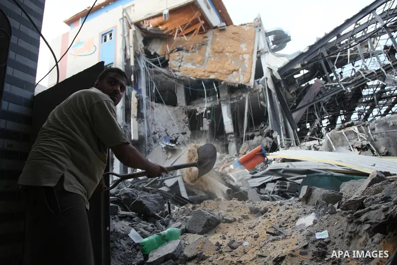 Rubble lies around the Al Aqsa television building that was destroyed in an Israeli strike in central Gaza City on July 29, 2014. Following two nights without air strikes, the violence returned to Gaza's skies overnight,...