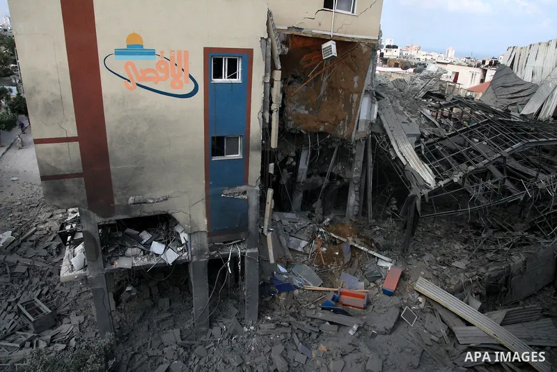 Rubble lies around the Al Aqsa television building that was destroyed in an Israeli strike in central Gaza City on July 29, 2014. Following two nights without air strikes, the violence returned to Gaza's skies overnight,...