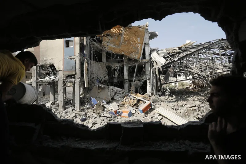 Rubble lies around the Al Aqsa television building that was destroyed in an Israeli strike in central Gaza City on July 29, 2014. Following two nights without air strikes, the violence returned to Gaza's skies overnight,...