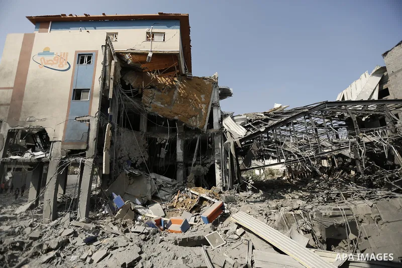 Rubble lies around the Al Aqsa television building that was destroyed in an Israeli strike in central Gaza City on July 29, 2014. Following two nights without air strikes, the violence returned to Gaza's skies overnight,...