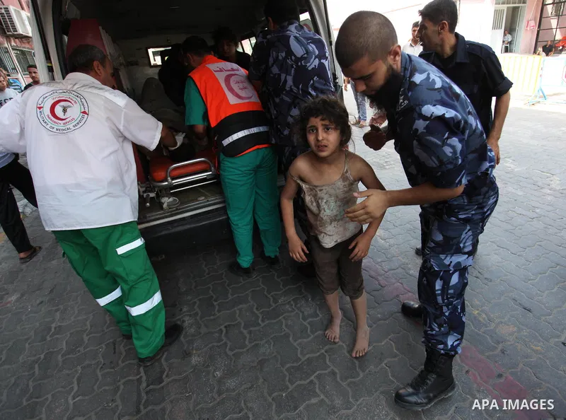 Palestinian medics treat a girl, who was wounded in an Israeli air strike, at Nasser hospital in Khan Younis in the southern Gaza Strip, July 29, 2014 Israel knocked out Gaza's only power plant, flattened the home of its...