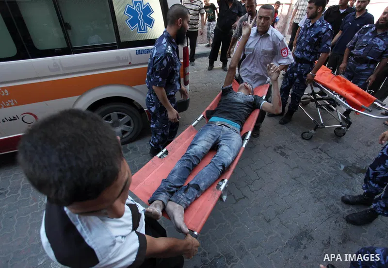Palestinian medics treat a man, who was wounded in an Israeli air strike, at Nasser hospital in Khan Younis in the southern Gaza Strip, July 29, 2014 Israel knocked out Gaza's only power plant, flattened the home of its...