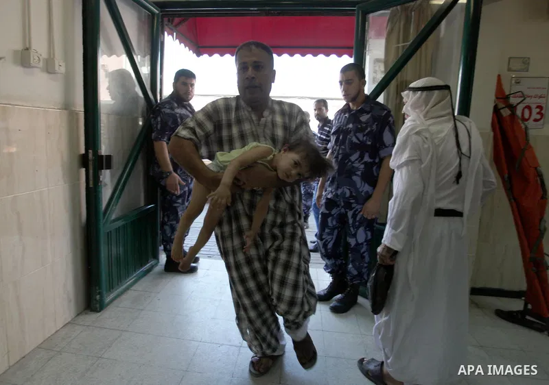 Palestinian medics treat child, who was wounded in an Israeli air strike, at Nasser hospital in Khan Younis in the southern Gaza Strip, July 29, 2014 Israel knocked out Gaza's only power plant, flattened the home of its...