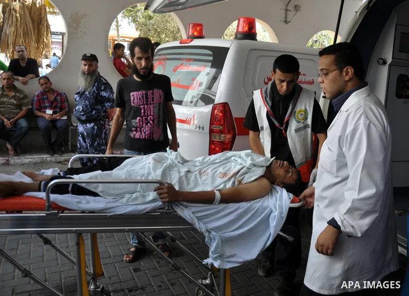 A Palestinian man, receiving treatment in Shifa hospital in Gaza City, on July 29, 2014. Israel's military pounded targets in the Gaza Strip on Tuesday after Prime Minister Benjamin Netanyahu said his country needed to b...