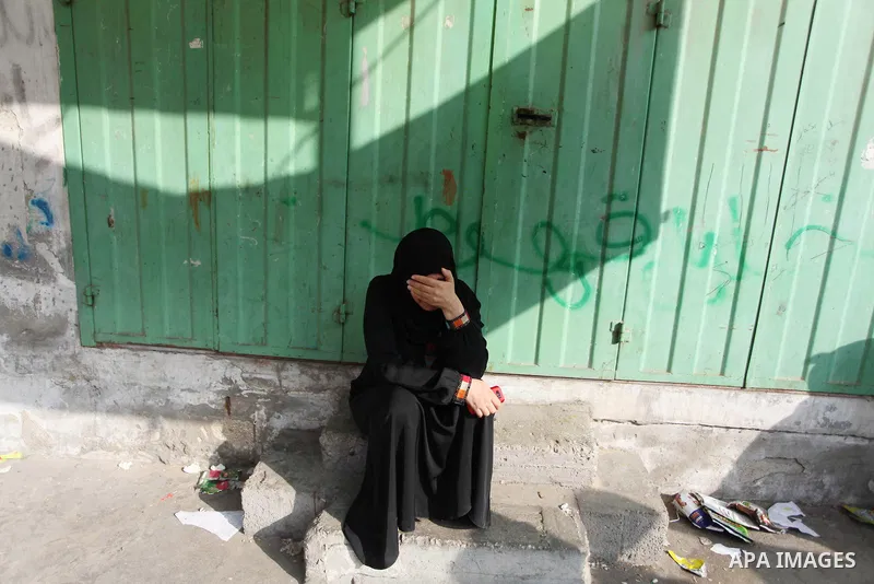 Palestinians who lost relatives in an Israeli strike on a compound housing a UN school in Jabalia refugee camp in the northern Gaza Strip, mourn outside the Kamal Edwin hospital in Beit Lahia where victims from the attac...