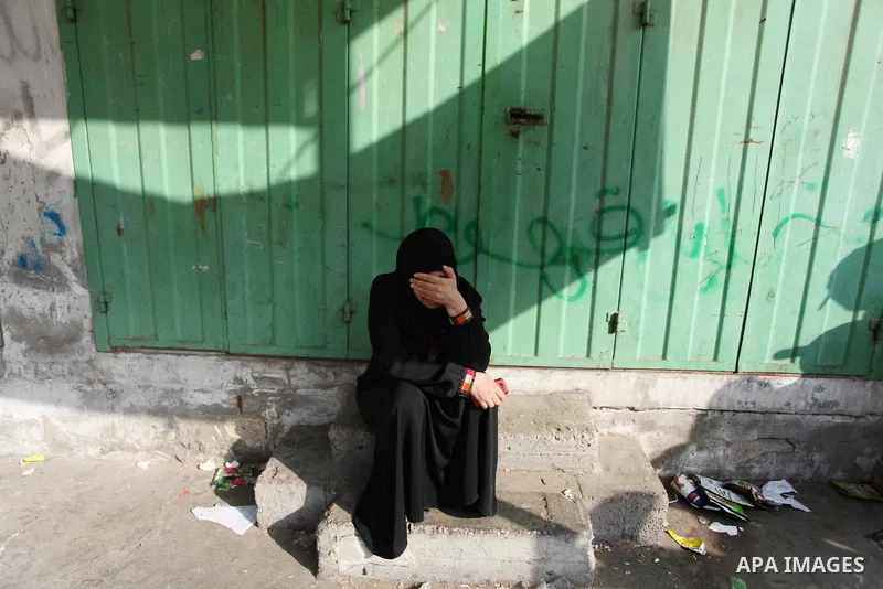 Palestinians who lost relatives in an Israeli strike on a compound housing a UN school in Jabalia refugee camp in the northern Gaza Strip, mourn outside the Kamal Edwin hospital in Beit Lahia where victims from the attac...