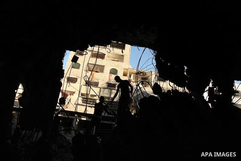 Palestinians inspect destruction in a mosque in Gaza City, on July 30, 2014 after it was hit in an overnight Israeli strike. Israeli bombardments killed "dozens" of Palestinians in Gaza, including at least 16 at a UN sch...