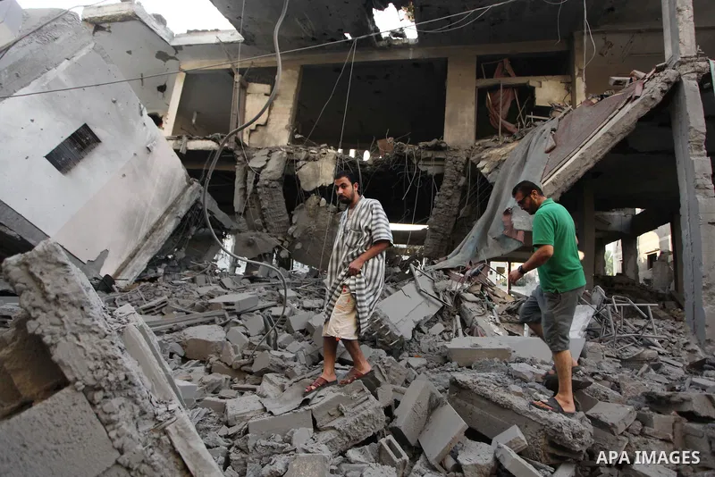 Palestinians inspect destruction in a mosque in Gaza City, on July 30, 2014 after it was hit in an overnight Israeli strike. Israeli bombardments killed "dozens" of Palestinians in Gaza, including at least 16 at a UN sch...