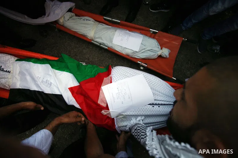Palestinians mourns two body of Zehir Al-Najar 7, and Ahmed Abu Baler 19, from the Gaza Strip, during thier funeral in East Jerusalem, on July 30, 2014 after they died from injuries sustained following an Israeli militar...