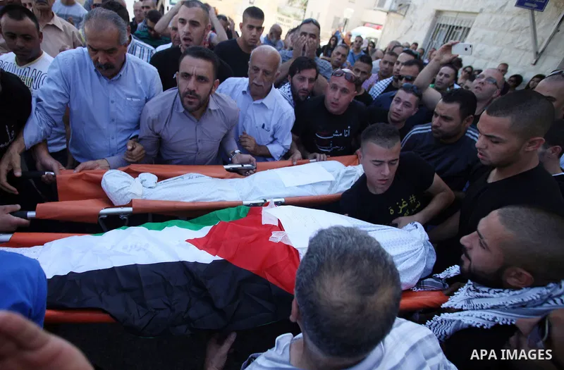 Palestinians mourns two body of Zehir Al-Najar 7, and Ahmed Abu Baler 19, from the Gaza Strip, during thier funeral in East Jerusalem, on July 30, 2014 after they died from injuries sustained following an Israeli militar...