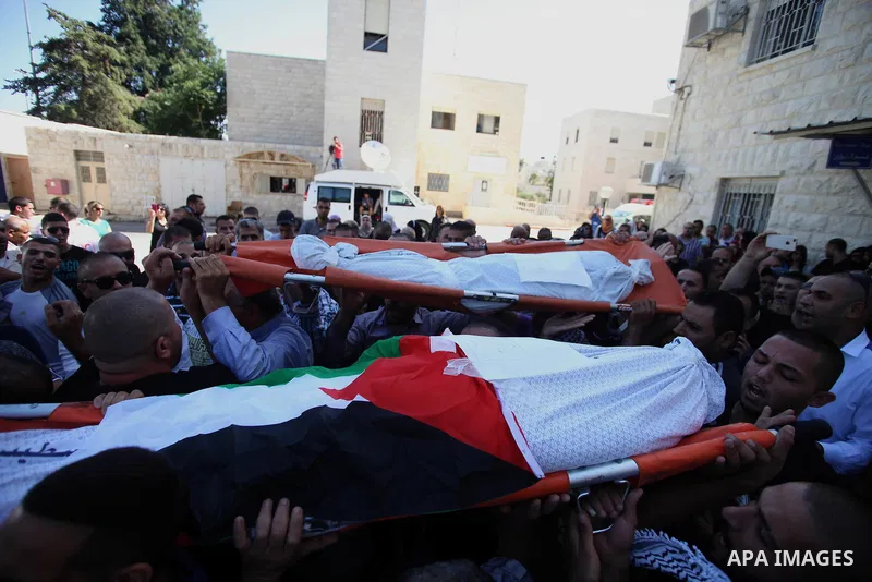 Palestinians mourns two body of Zehir Al-Najar 7, and Ahmed Abu Baler 19, from the Gaza Strip, during thier funeral in East Jerusalem, on July 30, 2014 after they died from injuries sustained following an Israeli militar...