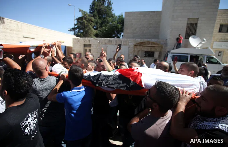 Palestinians mourns two body of Zehir Al-Najar 7, and Ahmed Abu Baler 19, from the Gaza Strip, during thier funeral in East Jerusalem, on July 30, 2014 after they died from injuries sustained following an Israeli militar...