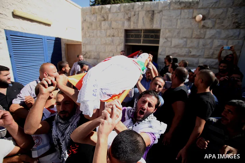 Palestinians mourns two body of Zehir Al-Najar 7, and Ahmed Abu Baler 19, from the Gaza Strip, during thier funeral in East Jerusalem, on July 30, 2014 after they died from injuries sustained following an Israeli militar...