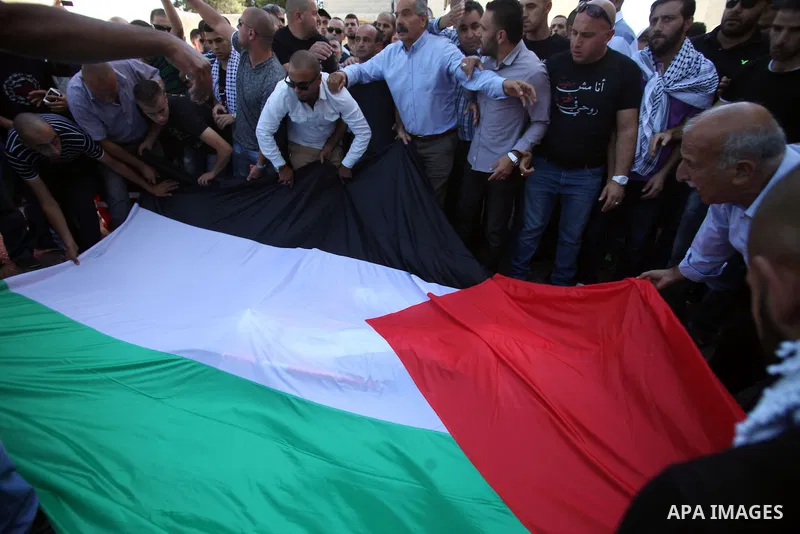 Palestinians mourns two body of Zehir Al-Najar 7, and Ahmed Abu Baler 19, from the Gaza Strip, during thier funeral in East Jerusalem, on July 30, 2014 after they died from injuries sustained following an Israeli militar...