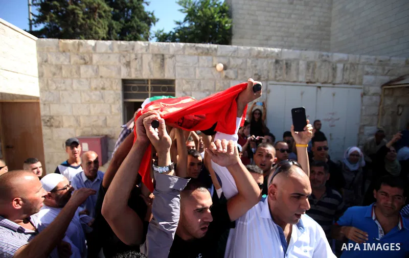 Palestinians mourns two body of Zehir Al-Najar 7, and Ahmed Abu Baler 19, from the Gaza Strip, during thier funeral in East Jerusalem, on July 30, 2014 after they died from injuries sustained following an Israeli militar...