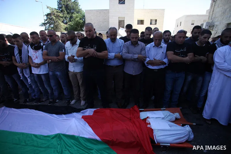 Palestinians mourns two body of Zehir Al-Najar 7, and Ahmed Abu Baler 19, from the Gaza Strip, during thier funeral in East Jerusalem, on July 30, 2014 after they died from injuries sustained following an Israeli militar...