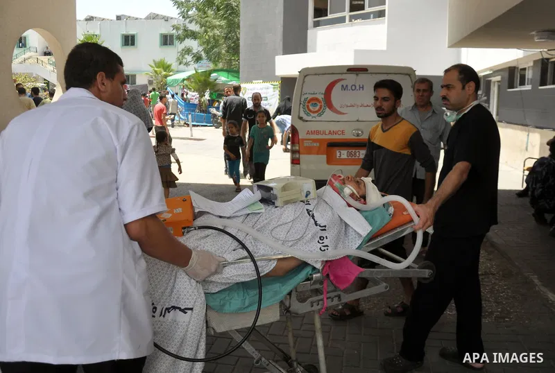 Palestinian medics treat children for their injuries caused by an Israeli strike at a house, at the El-Shifa hospital in Gaza City, Wednesday, July 30, 2014. Several Israeli tank shells slammed into the crowded U.N. scho...