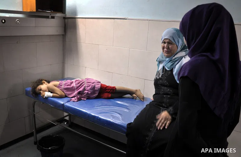 Palestinian medics treat children for their injuries caused by an Israeli strike at a house, at the El-Shifa hospital in Gaza City, Wednesday, July 30, 2014. Several Israeli tank shells slammed into the crowded U.N. scho...