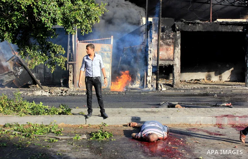 A Palestinian lays on the ground following an Israeli Strike in Shijaiyah neighborhood, eastern Gaza City, Wednesday, July 30, 2014. . Photo by Omar Abed