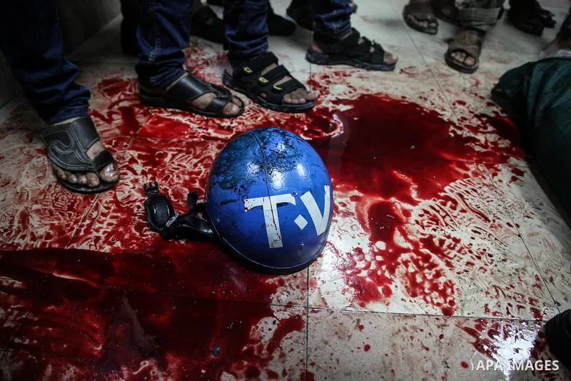 Palestinians wheel the lifeless body of video journalist, Rami Rayan, following an Israeli Strike in Shijaiyah neighborhood, to the emergency room of the Shifa Hospital, in Gaza City, Wednesday, July 30, 2014.Photo by Ez...