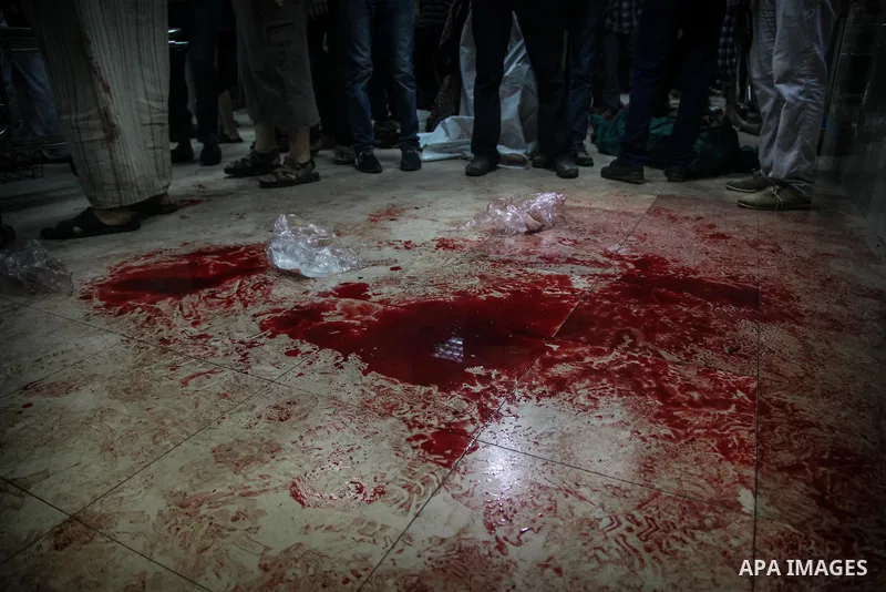 Palestinians cry after identifying their loved one, killed on an Israeli strike in Shijaiyah neighbourhood, at the morgue of Gaza City's Shifa hospital, Wednesday July 30, 2014. Israeli strikes hit the crowded shopping a...