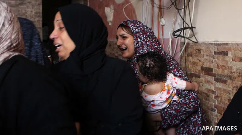 Palestinian relatives of Mohammed al-Daeri, 25, mourn during his funeral in Gaza City on July 31, 2014. At least 10 people were killed in Israeli strikes on central and southern Gaza bringing the Palestinian death toll t...