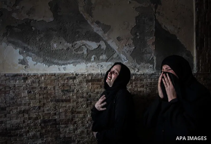 Palestinian relatives of Mohammed al-Daeri, 25, mourn during his funeral in Gaza City on July 31, 2014. At least 10 people were killed in Israeli strikes on central and southern Gaza bringing the Palestinian death toll t...