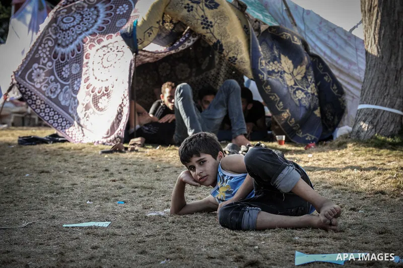 A displaced Palestinian boy plays at the al-Shifa hospital in Gaza City where many Palestinians have have taken refuge after fleeing attacks in the Shejaiya neighbourhood of the city, on July 31, 2014. With more than 220...