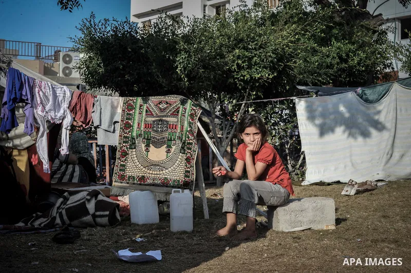 Displaced Palestinian children gather at the al-Shifa hospital in Gaza City where they have taken refuge after fleeing heavy fighting in the Shejaiya neighbourhood of the city, on July 31, 2014. With more than 220,000 Pa...