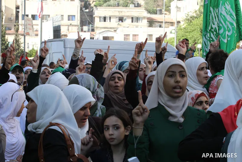 Hamas supporters shout slogans against the Israeli military action in Gaza, during a demonstration in the West Bank city of Nablus, Thursday, July 31, 2014. Photo by Nedal Eshtayah