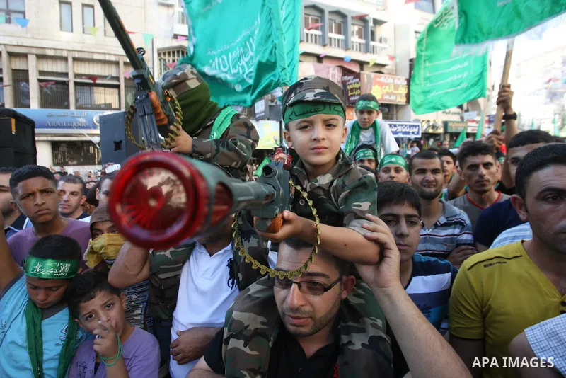 Hamas supporters shout slogans against the Israeli military action in Gaza, during a demonstration in the West Bank city of Nablus, Thursday, July 31, 2014. Photo by Nedal Eshtayah