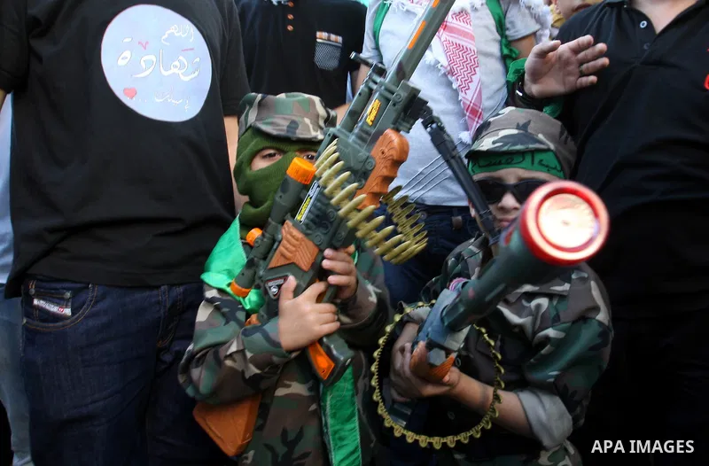 Hamas supporters shout slogans against the Israeli military action in Gaza, during a demonstration in the West Bank city of Nablus, Thursday, July 31, 2014. Photo by Nedal Eshtayah